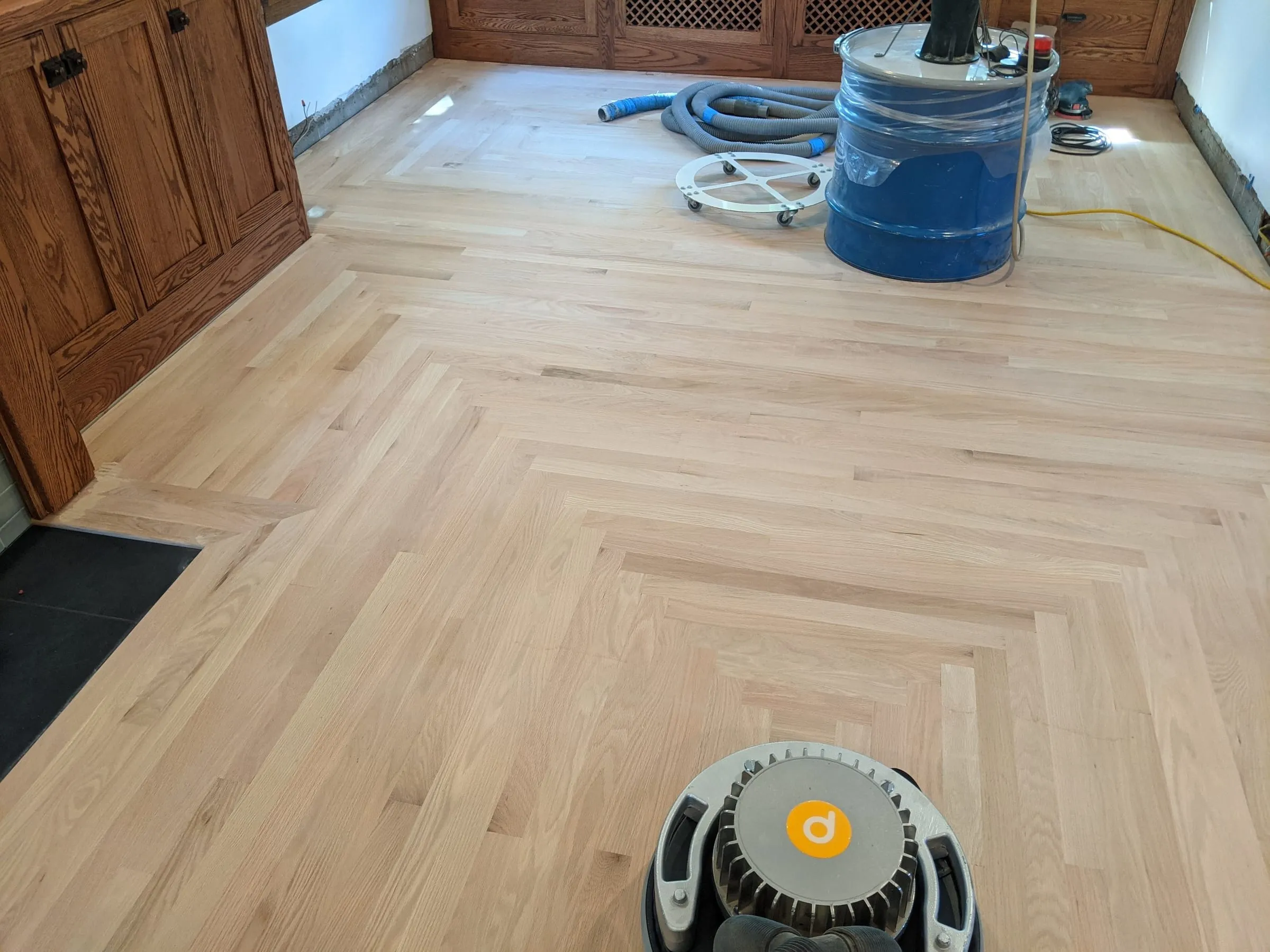 Freshly sanded oak floor with a decorative border pattern